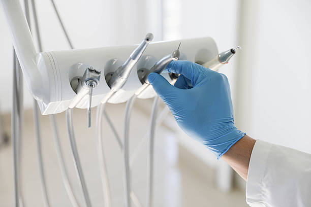 Professional Tooth Extraction technician working in El Dorado, KS